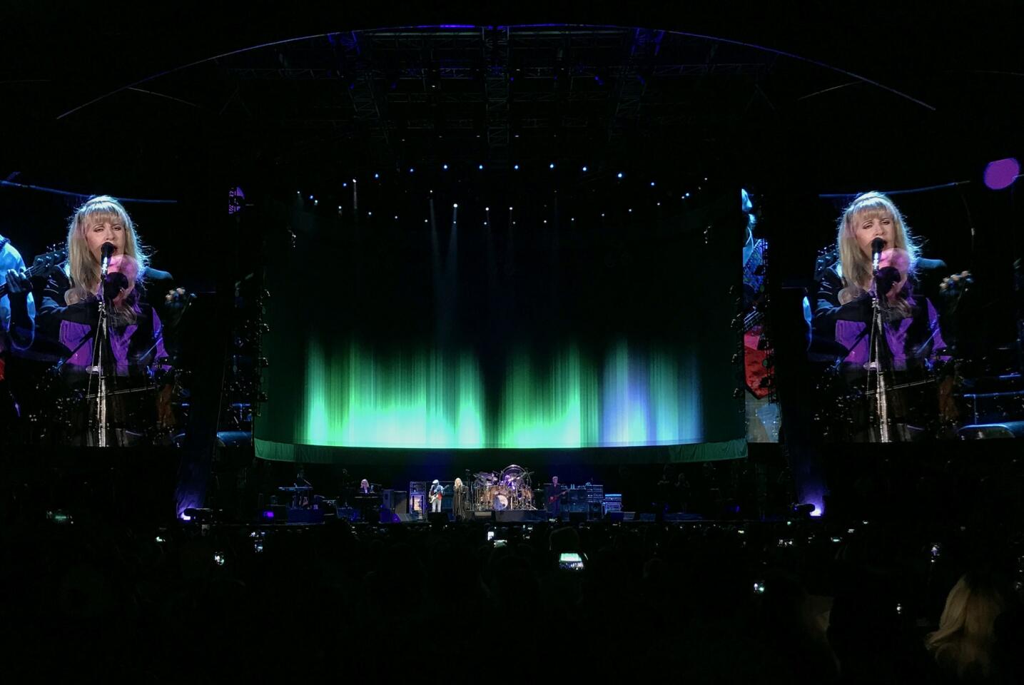 Fleetwood Mac on stage with lead singer Stevie Nicks' image projected on the screens during the Classic West festival at Dodger Stadium in Los Angeles.