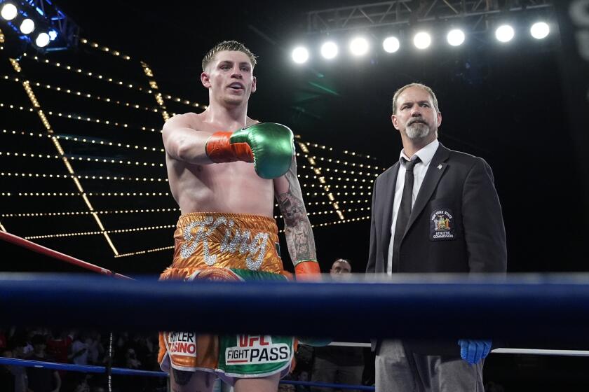 Ireland's Callum Walsh, left, gestures to loved ones after a super welterweight boxing match against Kazakhstan's Dauren Yeleussinov, Friday, March 15, 2024, in New York. Walsh stopped Yeleussinov in the ninth round. (AP Photo/Frank Franklin II)