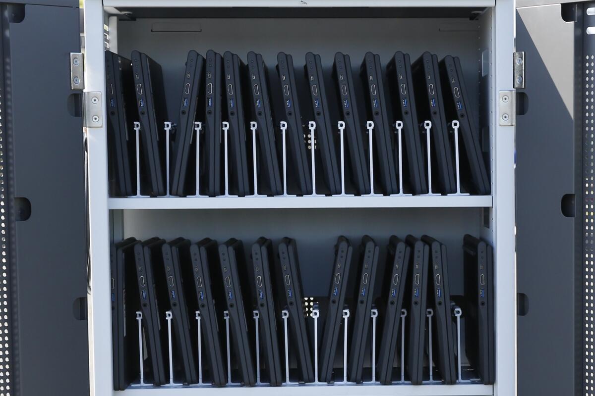 Chromebooks await distribution at a school.