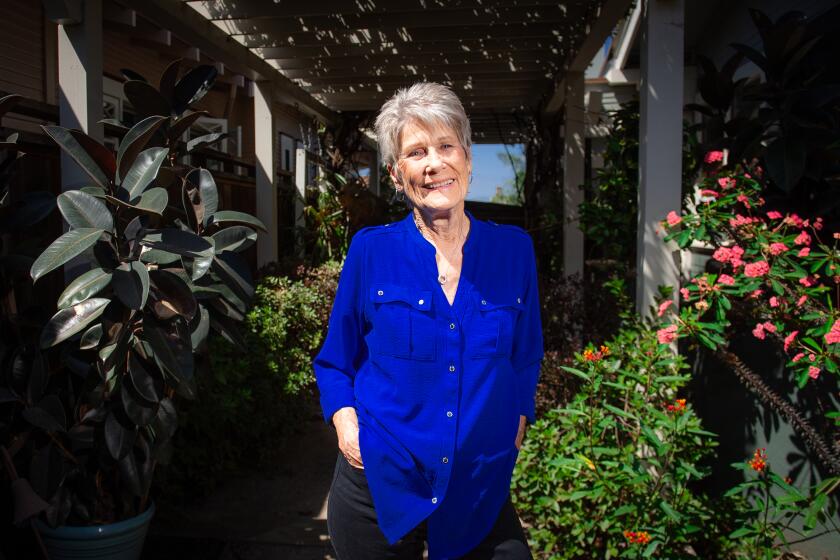 San Diego, CA - September 13: Judy Reeves, writer and writing instructor, and a long-time fixture in the San Diego literary arts community, poses for a photo outside her home on Wednesday, Sept. 13, 2023 in San Diego, CA. (Meg McLaughlin / The San Diego Union-Tribune)