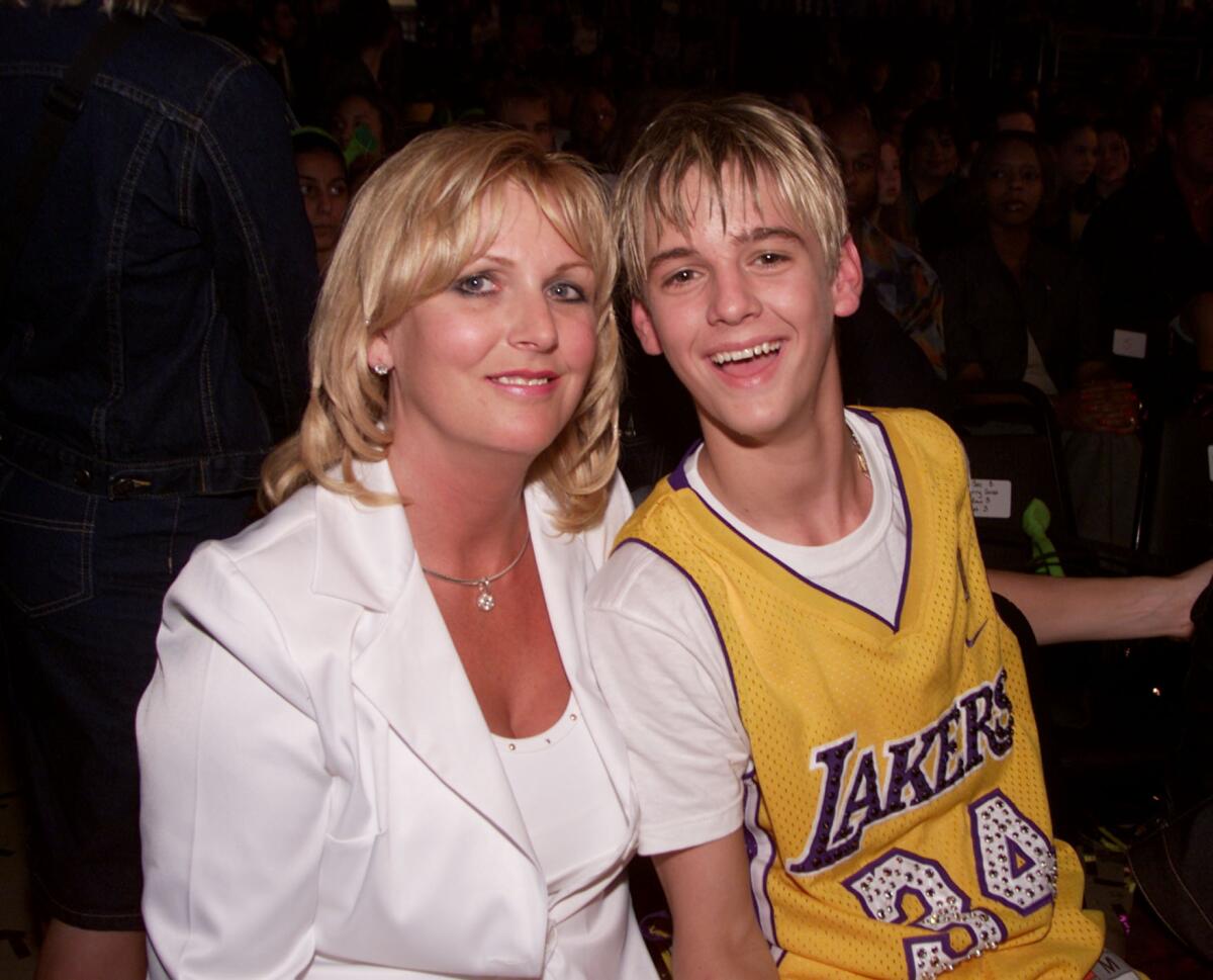 A young Aaron Carter, right, poses with his mother.