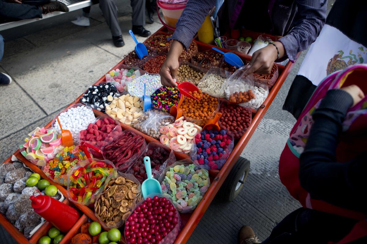 A street vendor selling sweet snacks in Mexico City