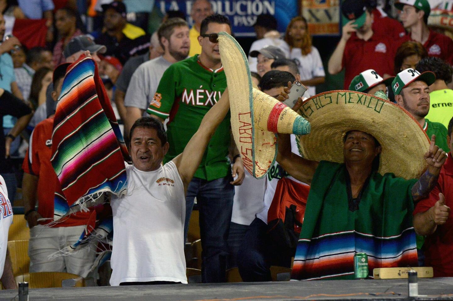 Supporters of Mexico cheer for their team during their 2016 Caribbean baseball series game against Venezuela on February 3, 2016 in Santo Domingo. AFP PHOTO/YAMIL LAGEYAMIL LAGE/AFP/Getty Images ** OUTS - ELSENT, FPG, CM - OUTS * NM, PH, VA if sourced by CT, LA or MoD **