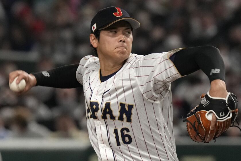 Shohei Ohtani of Japan delivers a pitch in the second inning of the Pool B game against China, at the World Baseball Classic (WBC) in Tokyo, Japan, Thursday, March 9, 2023.(AP Photo/Eugene Hoshiko)