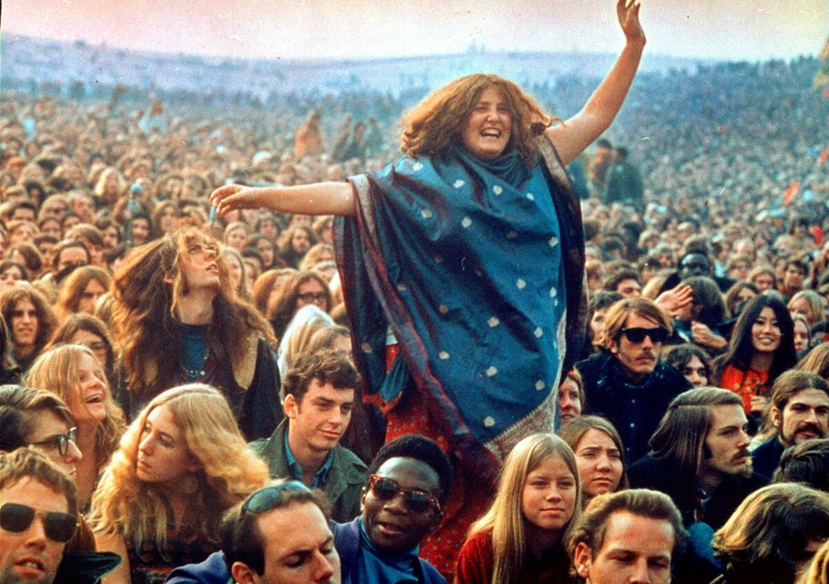 Fans frolic at the infamous "Gimme Shelter" rock concert featuring the Rolling Stones at the Altamont Race Track in Altamont, Calif., in 1969.