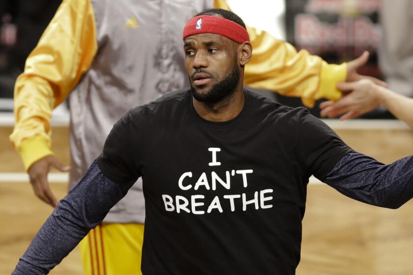 FILE - In this Dec. 8, 2014 file photo, Cleveland Cavaliers' LeBron James wears a T-shirt reading "I Can't Breathe," during warms up before an NBA basketball game against the Brooklyn Nets in New York. Celebrities have long played a significant role in social change, from Harry Belafonte marching for civil rights to Muhammad Aliâs anti-war activism. James and other basketball stars made news in 2014 when they wore T-shirts to protest the death of Eric Garner. (AP Photo/Frank Franklin II, File)