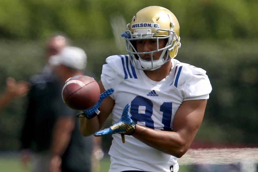 UCLA tight end Caleb Wilson makes a catch during practice on Aug. 8.