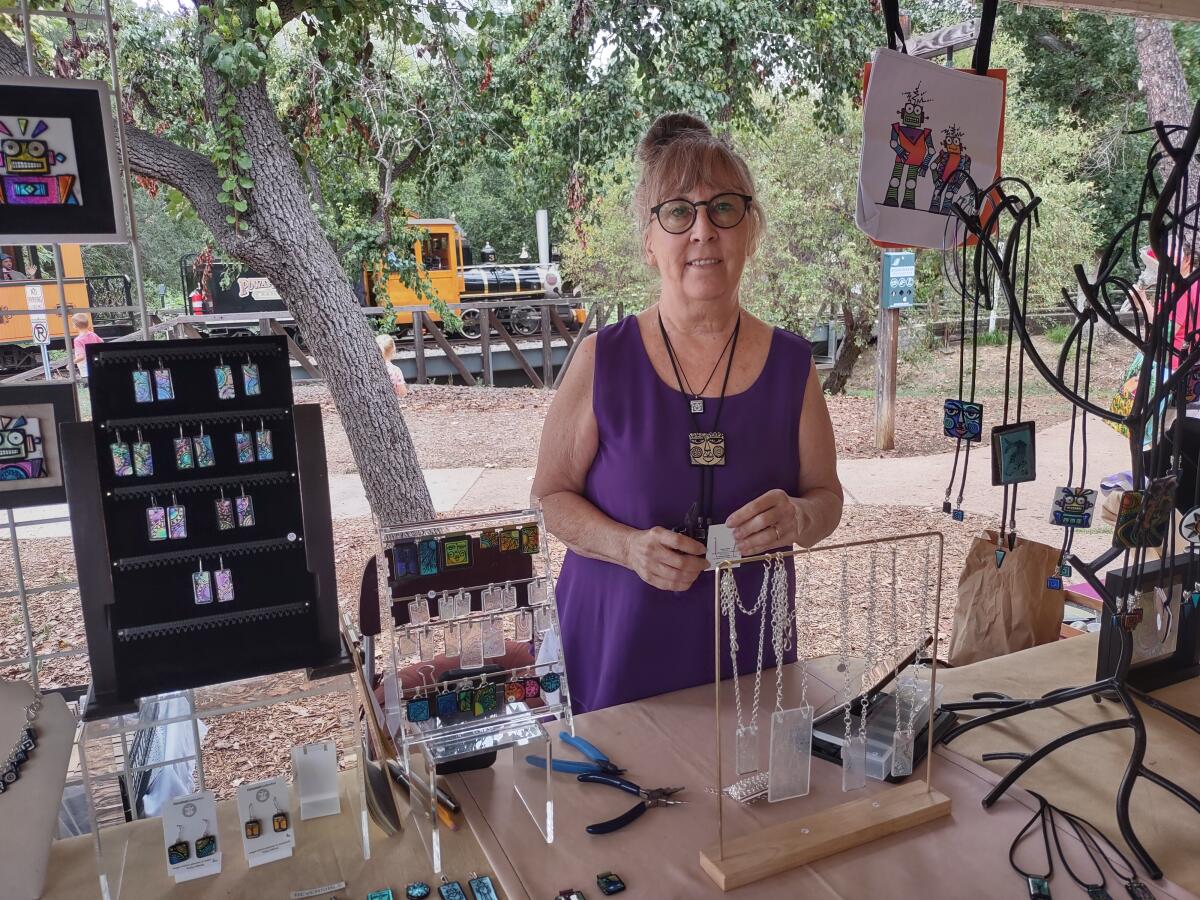 Poway resident Chris Stell of Chris Stell Creative Arts sells jewelry, bolo ties and robot glass art at the Artisan Market.