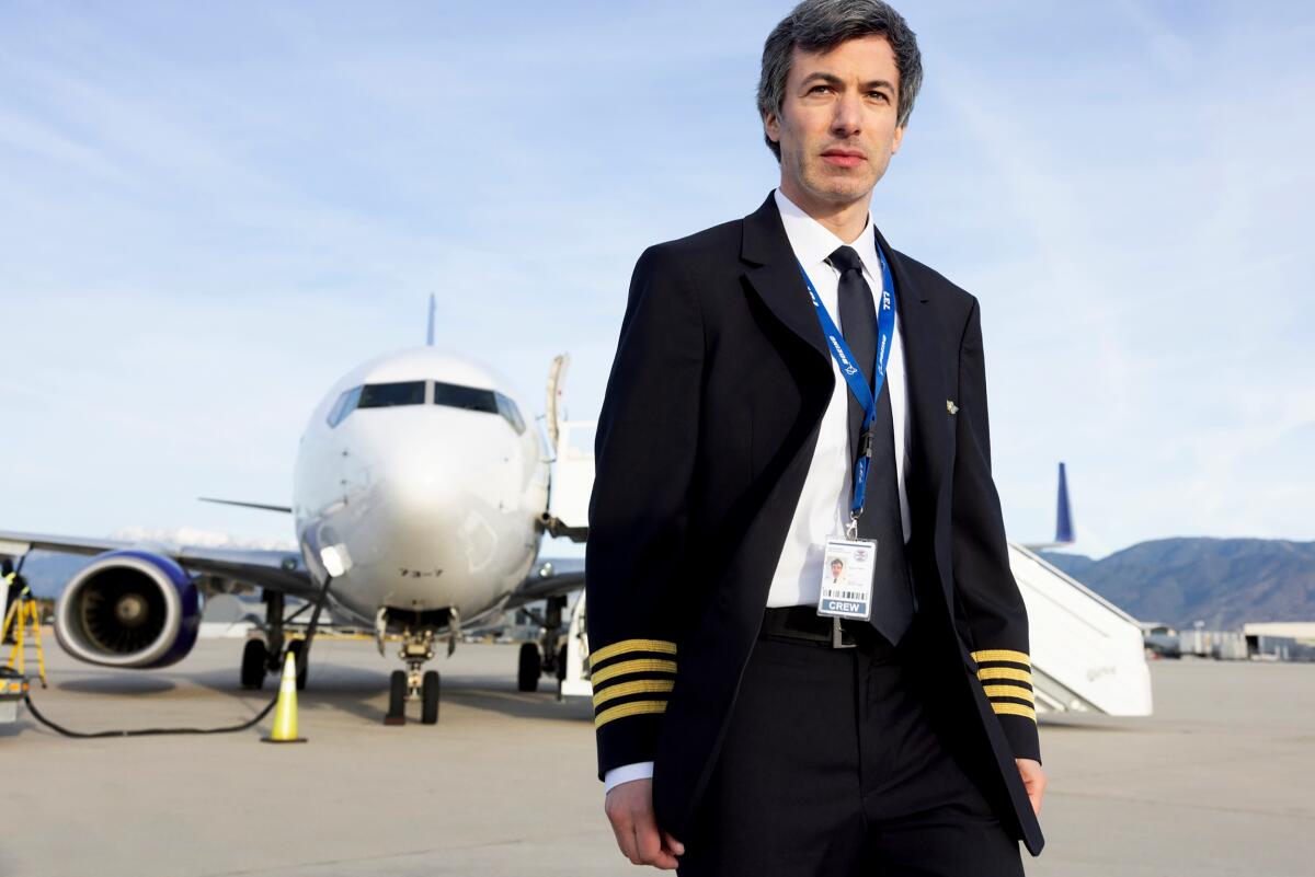 Comedian Nathan Fielder in a pilot's uniform