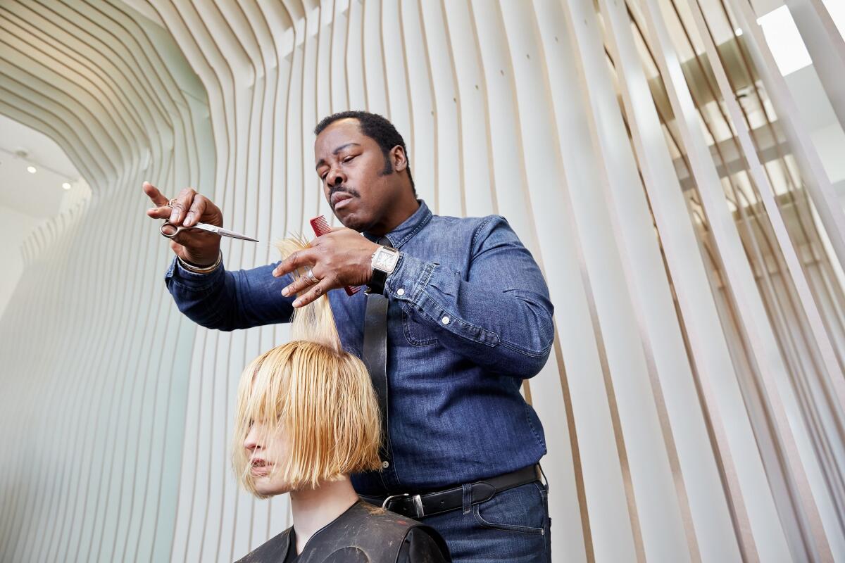 A photo of celebrity hairstylist Ted Gibson at work.