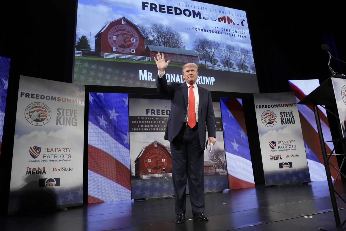 Donald Trump waves after speaking at the Freedom Summit Saturday in Iowa.
