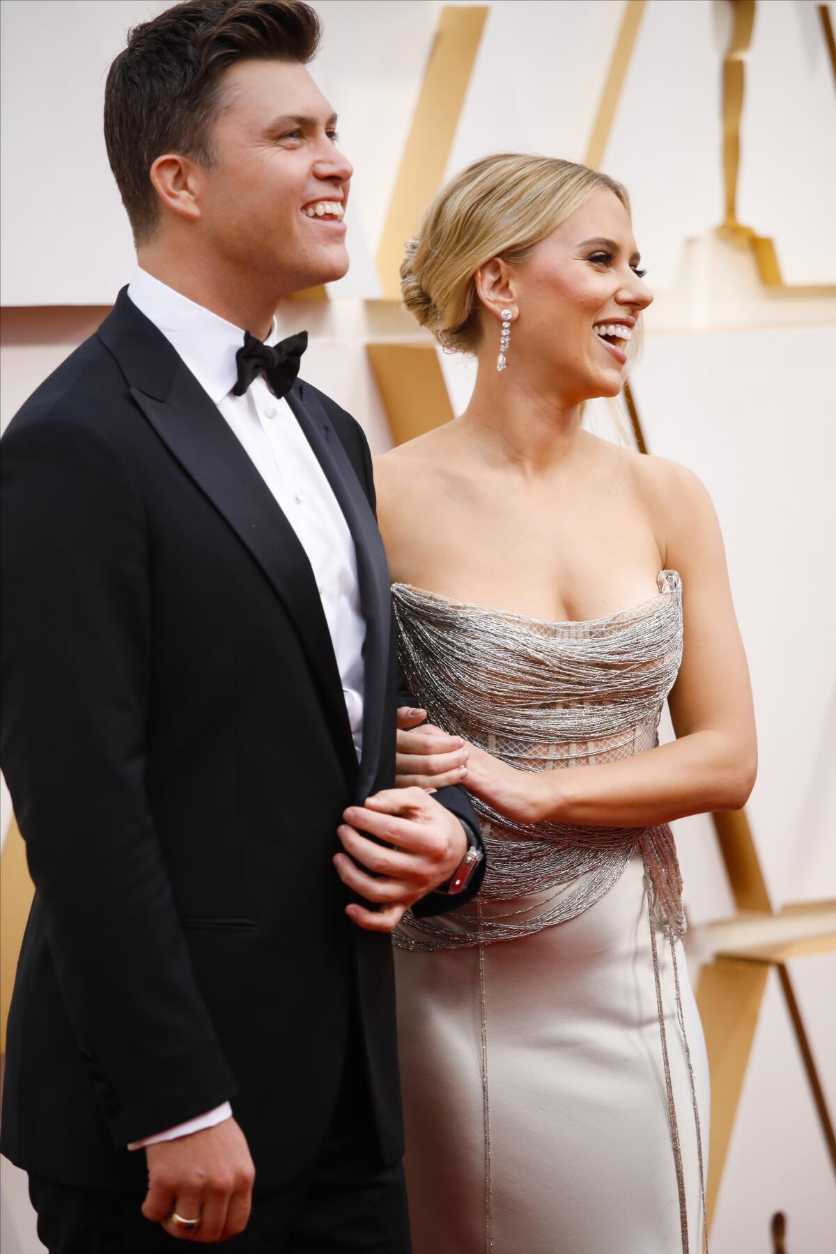 Colin Jost, left, and Scarlett Johansson