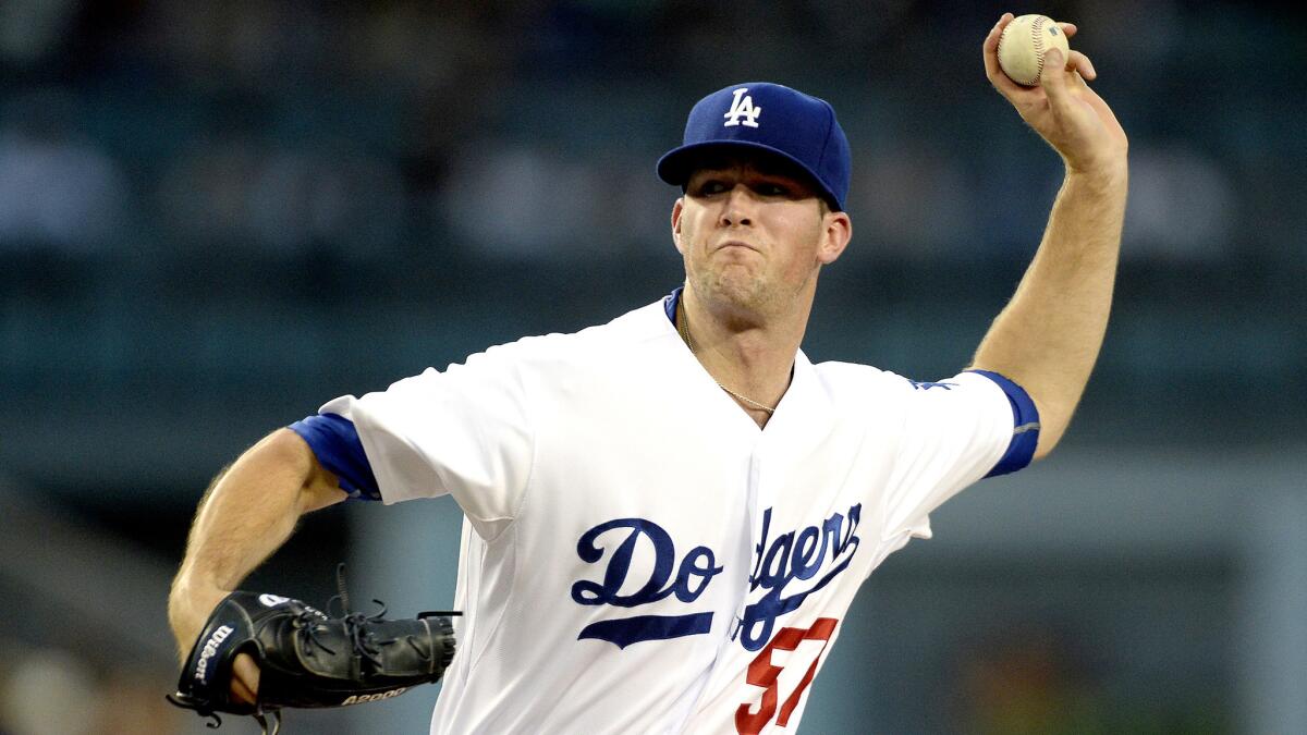 Dodgers starter Alex Wood improved his record to 8-7 with 6 1/3 innings against the Reds on Friday night.
