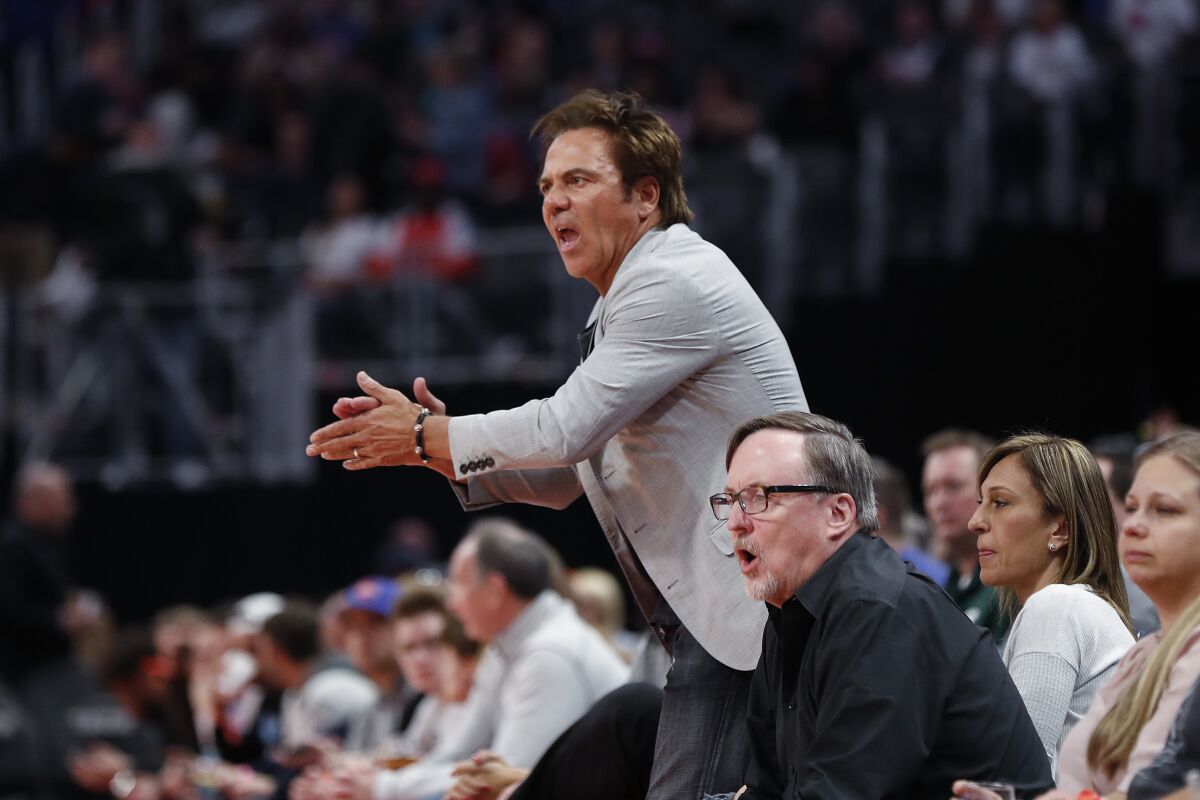 Detroit Pistons owner Tom Gores cheers during the NBA game against the Memphis Grizzlies in Detroit on April 9, 2019.