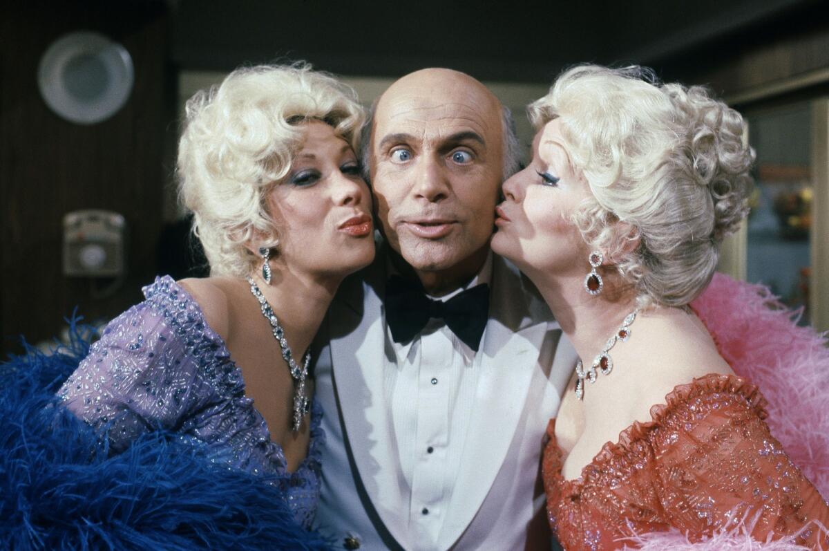 This Oct. 15, 1982 file photo shows Gavin MacLeod, center, with actress Debbie Reynolds, right, and Marilyn Michaels as special guest stars on ABC's "Love Boat."
