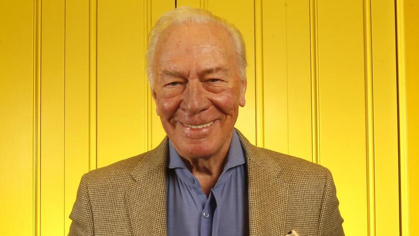 Christopher Plummer in front of a yellow wall