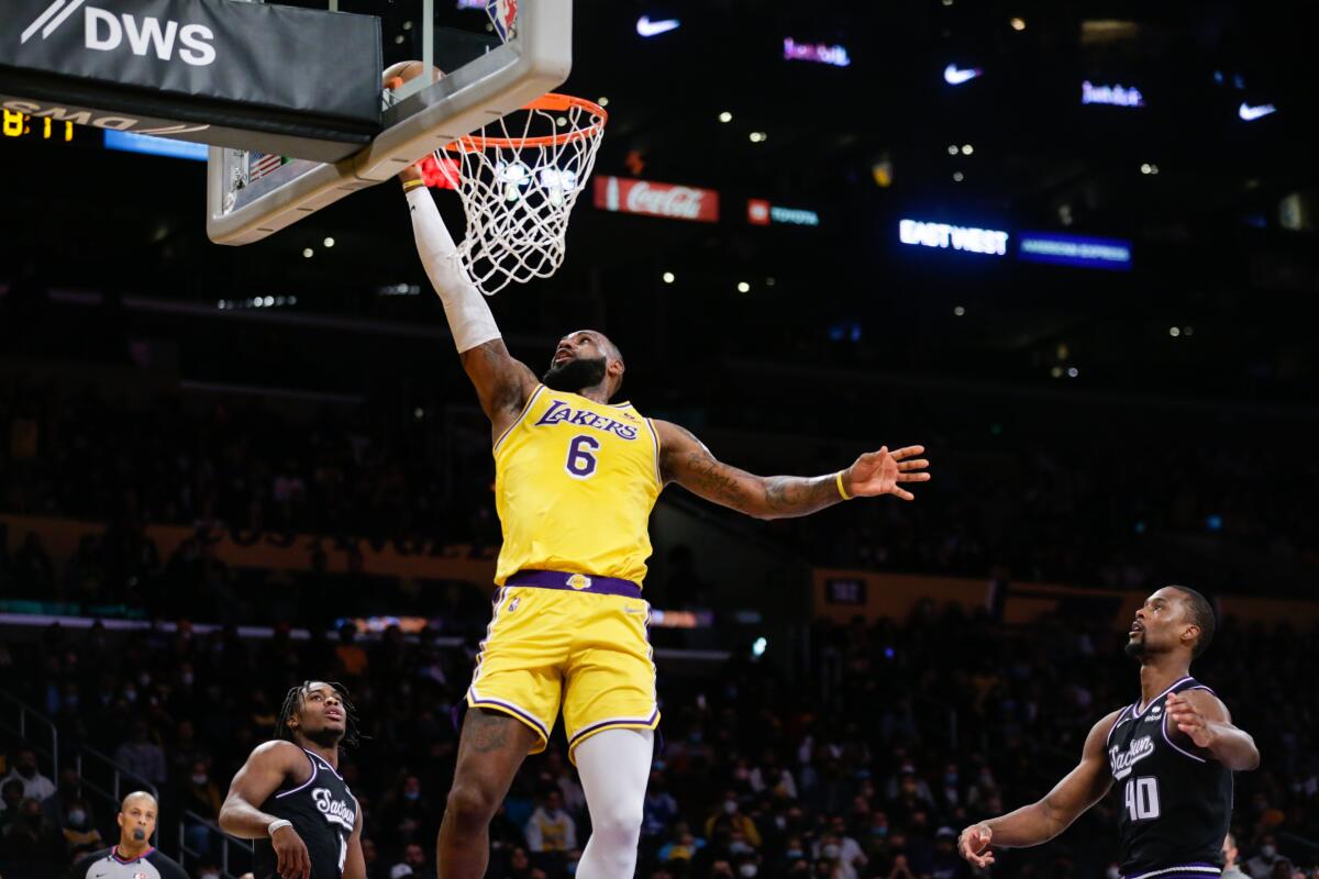 Lakers forward LeBron James attempts a dunk against the Sacramento Kings.
