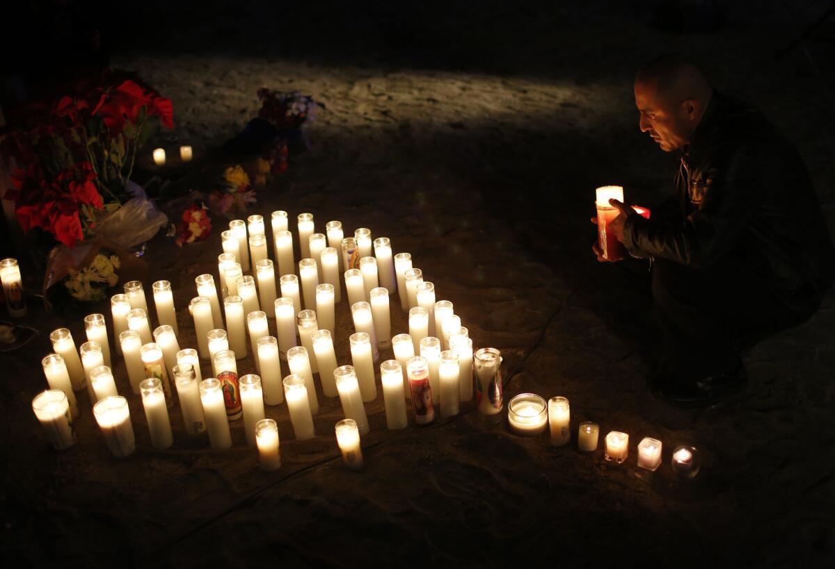 A memorial set up at the corner of Waterman Avenue and Orange Show Road near the scene of last week's mass shooting in San Bernardino.