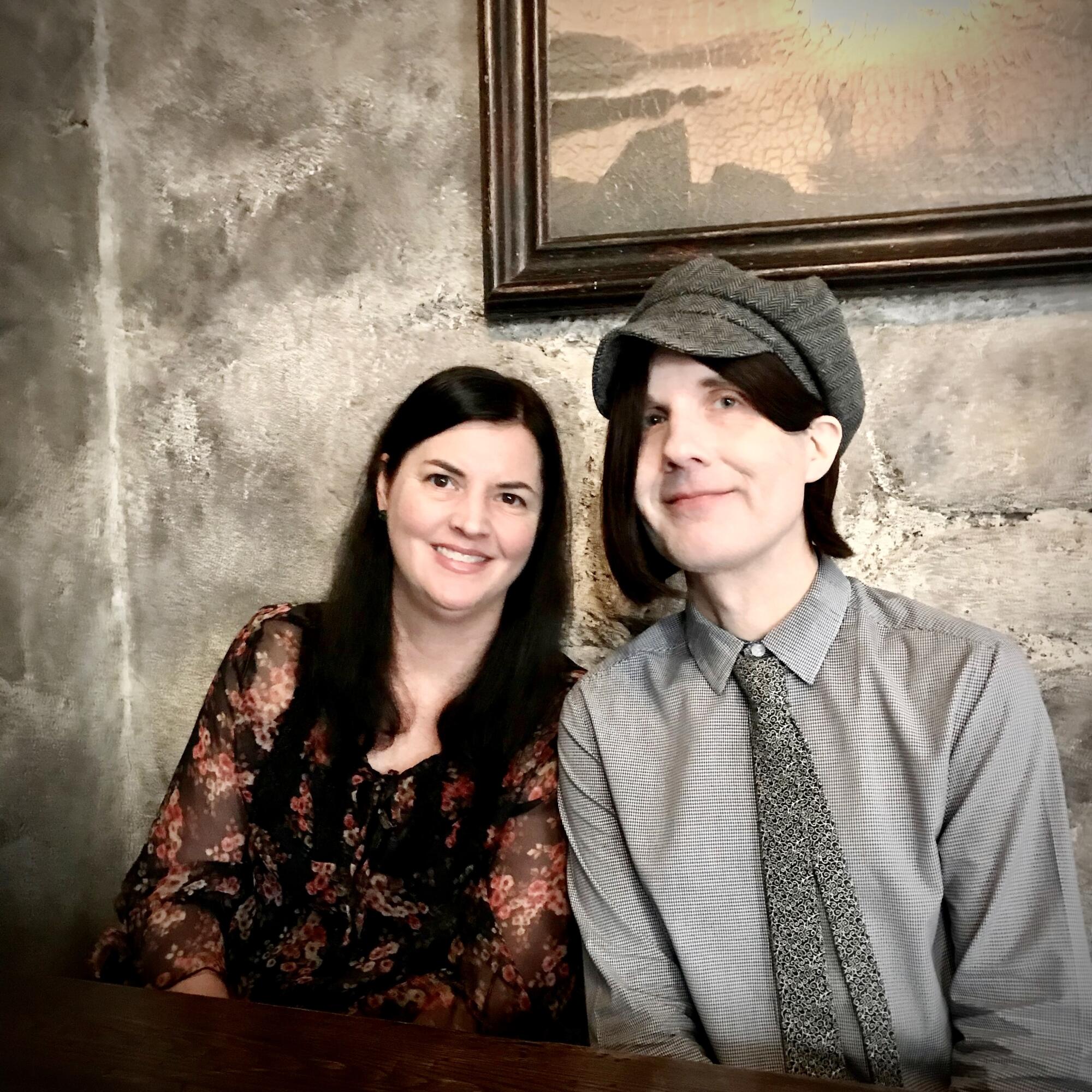 A woman and man in vintage formal wear.