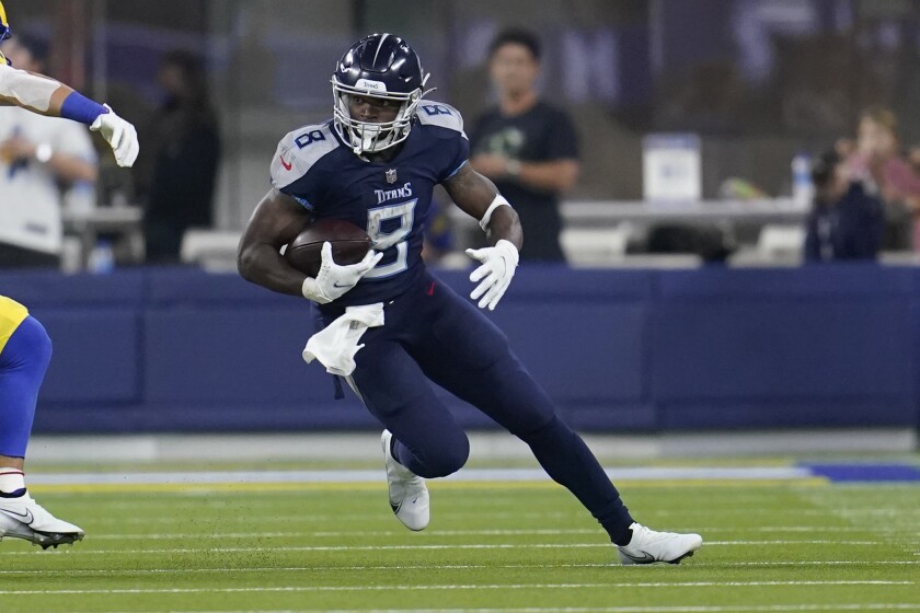 Tennessee Titans running back Adrian Peterson runs with the ball during the first half of an NFL football game against the Los Angeles Rams, Sunday, Nov. 7, 2021, in Inglewood, Calif. (AP Photo/Marcio Jose Sanchez)