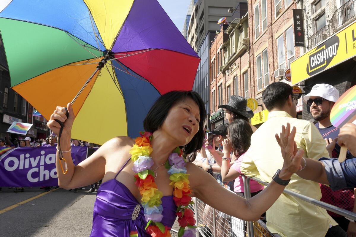 Toronto Mayor-elect Olivia Chow high-fiving someone