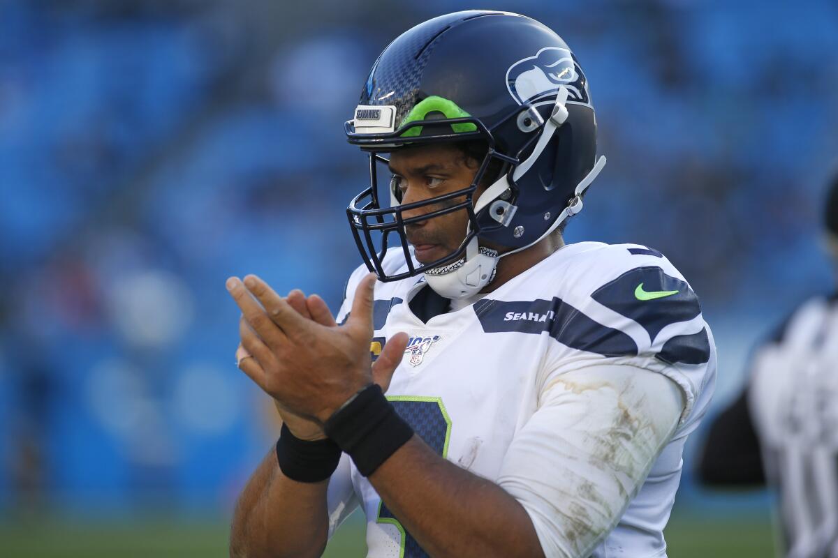 Wilson, Carson help Seahawks clinch NFC playoff spot - The San