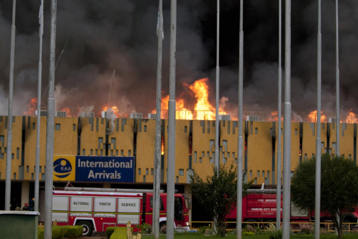 A blaze rages the International arrivals hall at Jomo Kenyatta International Airport in Nairobi, Kenya on Wednesday. The Kenya Airports Authority said the Kenya's main international airport has been closed until further notice.