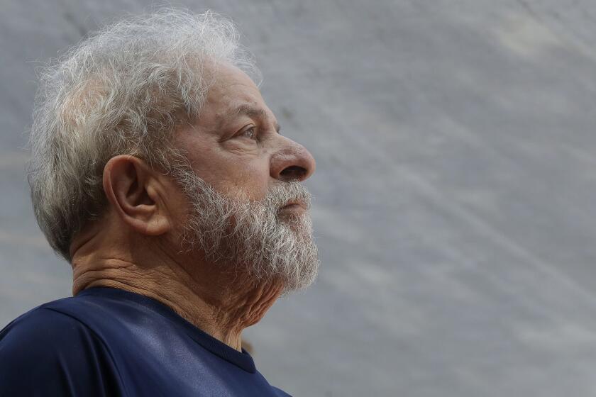 FILE - In this April 7, 2018 file photo, former Brazilian President Luiz Inacio Lula da Silva looks on before speaking to supporters outside the Metal Workers Union headquarters in Sao Bernardo do Campo, Brazil. Da Silva has decided not to go to the wake of his deceased older brother on Jan. 30, 2019 after he received permission to temporarily leave prison but not attend his relatives burial. Da Silva is serving a 12-year prison term for money laundering and corruption. (AP Photo/Andre Penner, File)