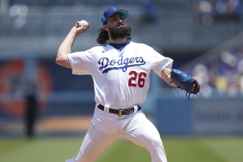 Los Angeles Dodgers starting pitcher Tony Gonsolin (26) throws during the first inning of a baseball game.