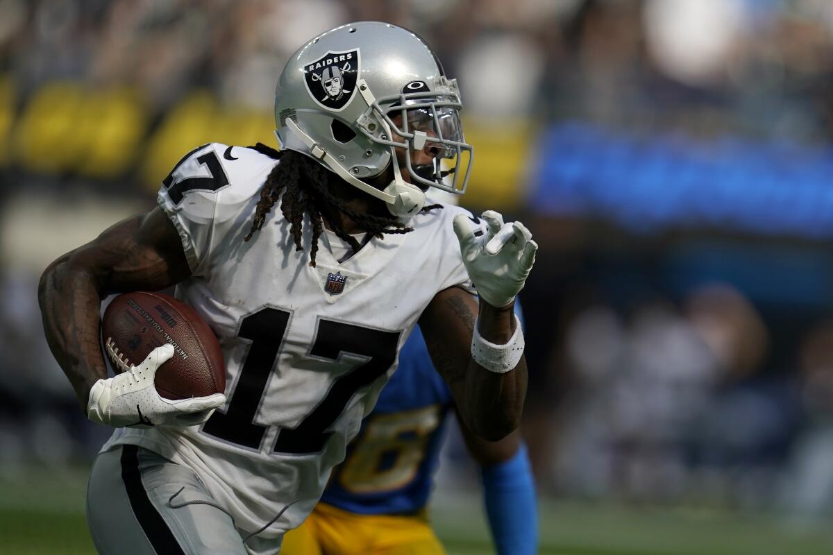 Las Vegas Raiders wide receiver Davante Adams (17) runs against the Los Angeles Chargers during the second half of an NFL football game in Inglewood, Calif., Sunday, Sept. 11, 2022. (AP Photo/Marcio Jose Sanchez)