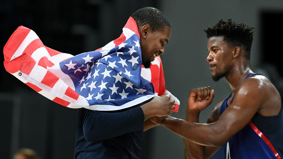 USA's Kevin Durant, left, and Jimmy Butler celebrate after winning the gold medal.