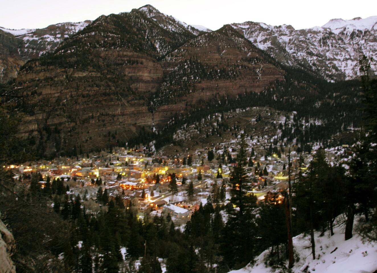 The Victorian-era Main Street is a National Historic District lined with restored storefronts. Looming above, the cliff-like peaks from the San Juan range surround the town on three sides and harbor the best winter ice-climbing routes in the country.