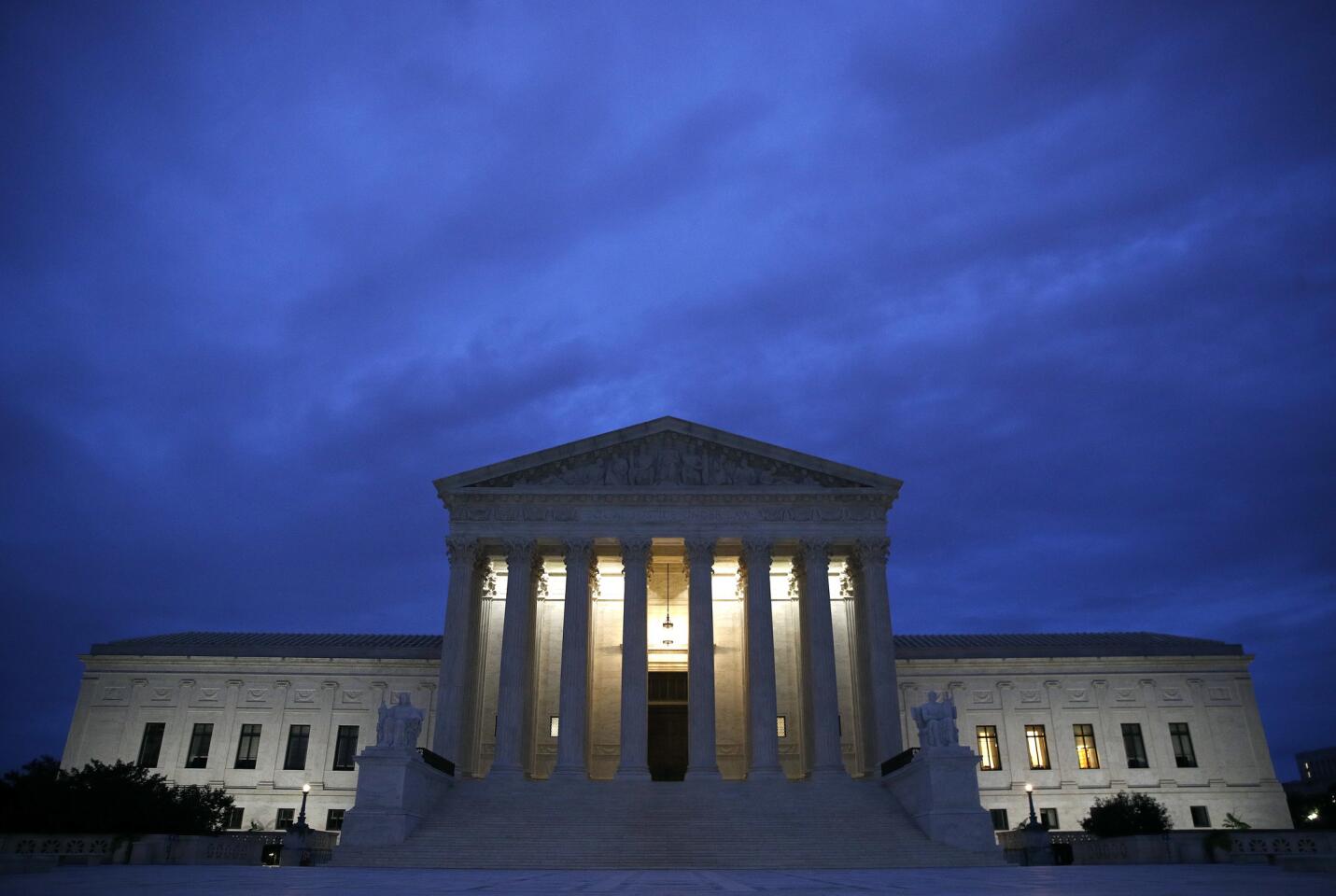 The Supreme Court building is seen at dawn on Capitol Hill in Washington.