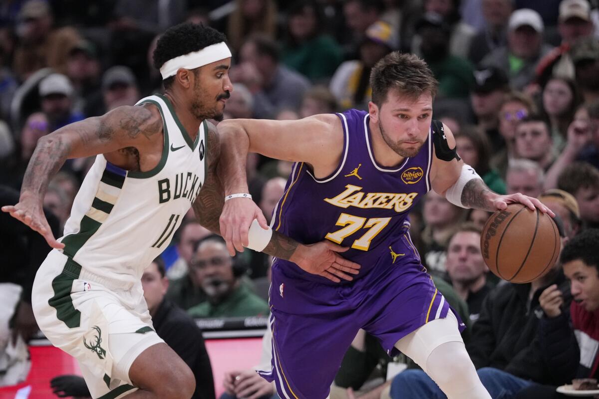 Lakers takeaways: What we discovered from the workforce's five-game highway journey 2 The Lakers' Luka Doncic drives past the Bucks' Gary Harris on Saturday in Milwaukee.