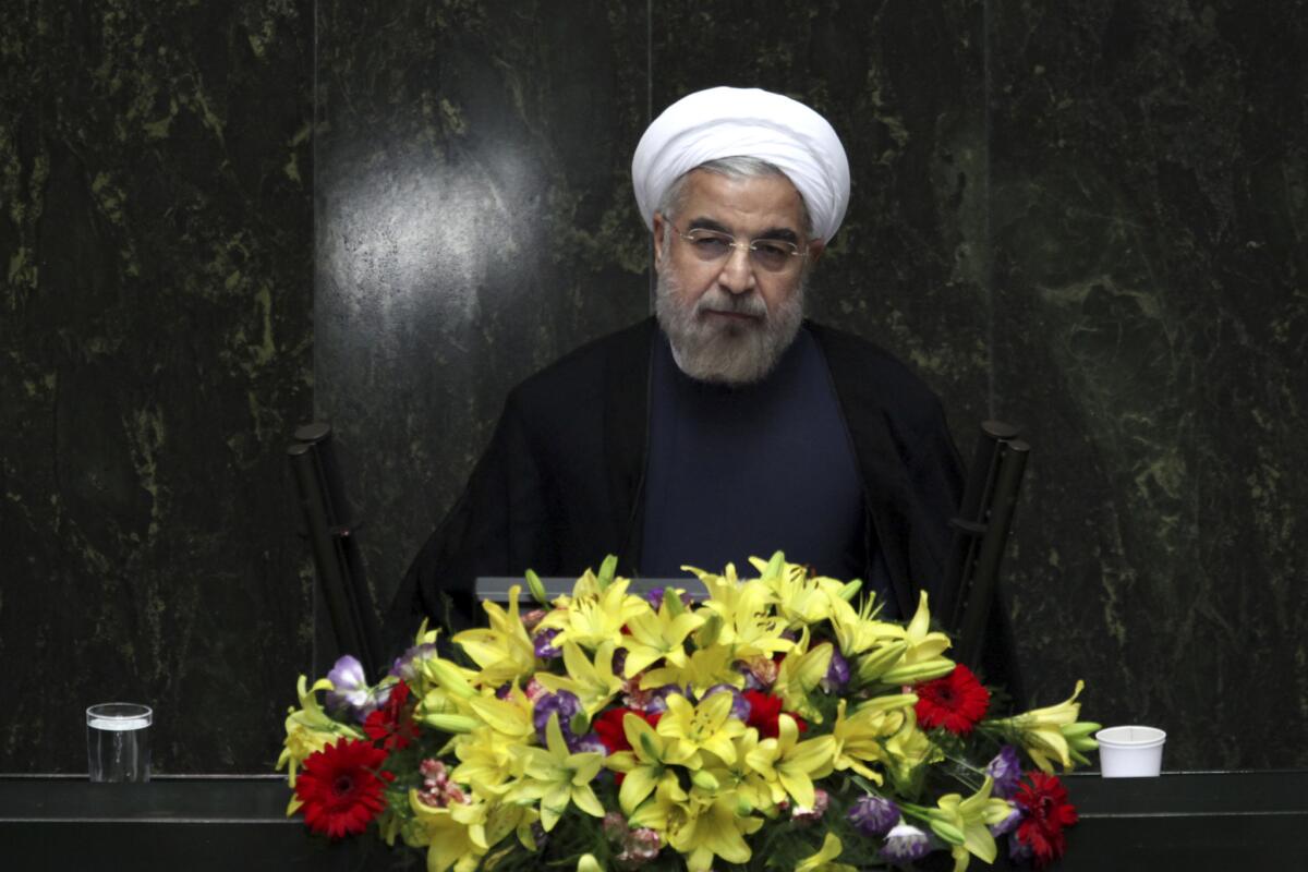 Western powers hope that new Iranian President Hasan Rouhani, shown at a debate in parliament, will moderate his nation's nuclear ambitions.
