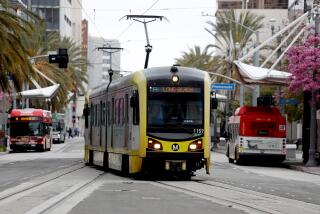 LONG BEACH, CA - APRIL 13: A metro car pulls into the Blue Line Metro 1st Street station in downtown on Thursday, April 13, 2023 in Long Beach, CA. People using the Blue Line Metro station where a man was stabbed to death on April 12th at the 1st Street station around 3:38 p.m. (Gary Coronado / Los Angeles Times)