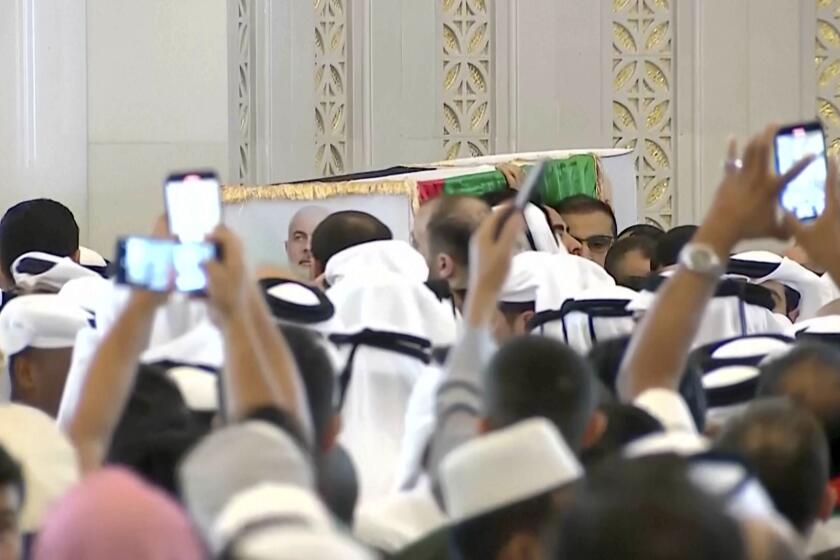 This video grab shows Hamas leader Ismail Haniyeh's coffin being carried out after the funeral prayers in Doha, Qatar, Friday Aug. 2, 2024. (Qatar TV via AP)
