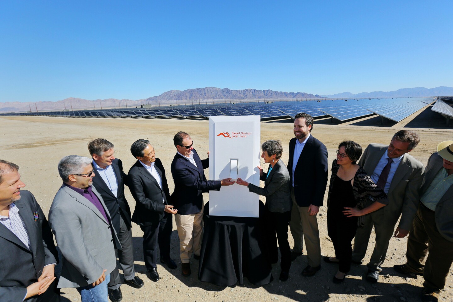 Armando Pimentel, President and CEO of NextEra Energy Resources, and U.S. of Interior Secretary Sally Jewell flip on a ceremonial power switch during a dedication ceremony for the new 550-megawatt Desert Sunlight solar farm on Feb. 9 in Riverside County.