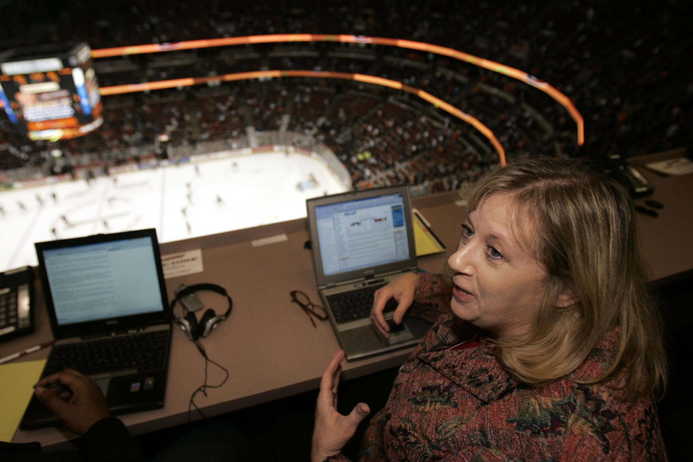 Los Angeles Times hockey writer and columnist, Helene Elliott, in the press box at Honda Center.