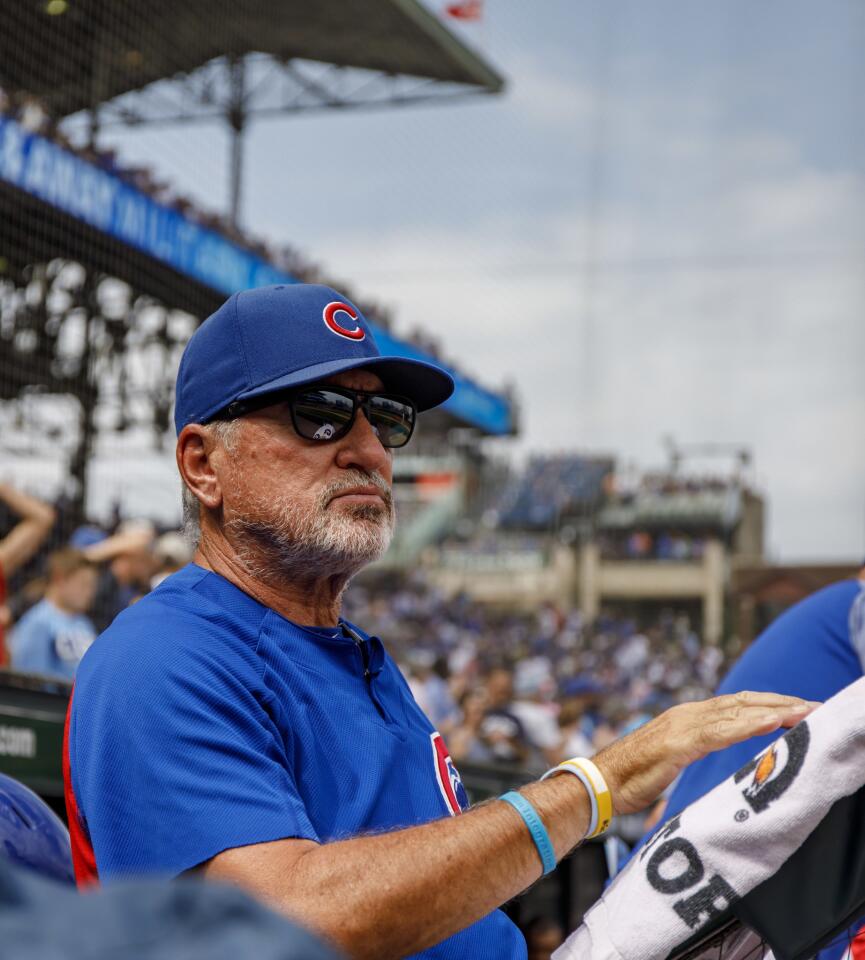 Cubs manager Joe Maddon looks at the action against the Brewers from his dugout perch Wednesday, Aug. 15, 2018 at Wrigley Field.