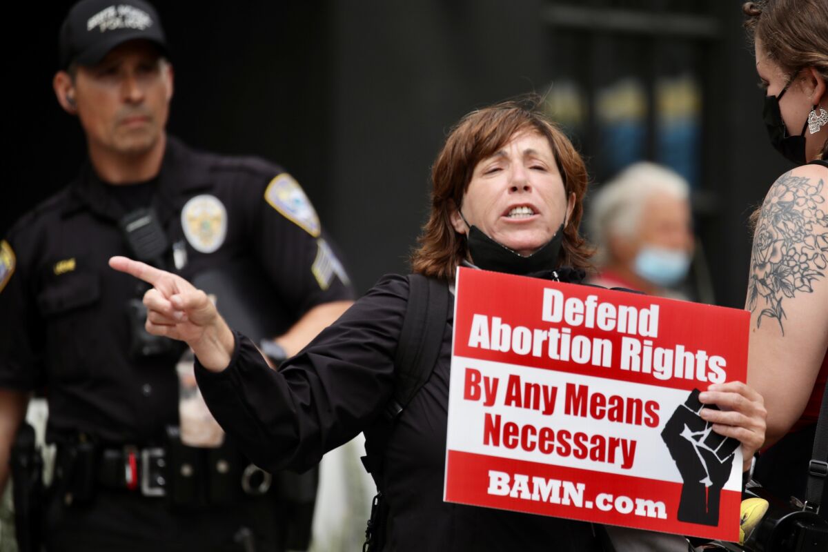 Woman holds sign during protest