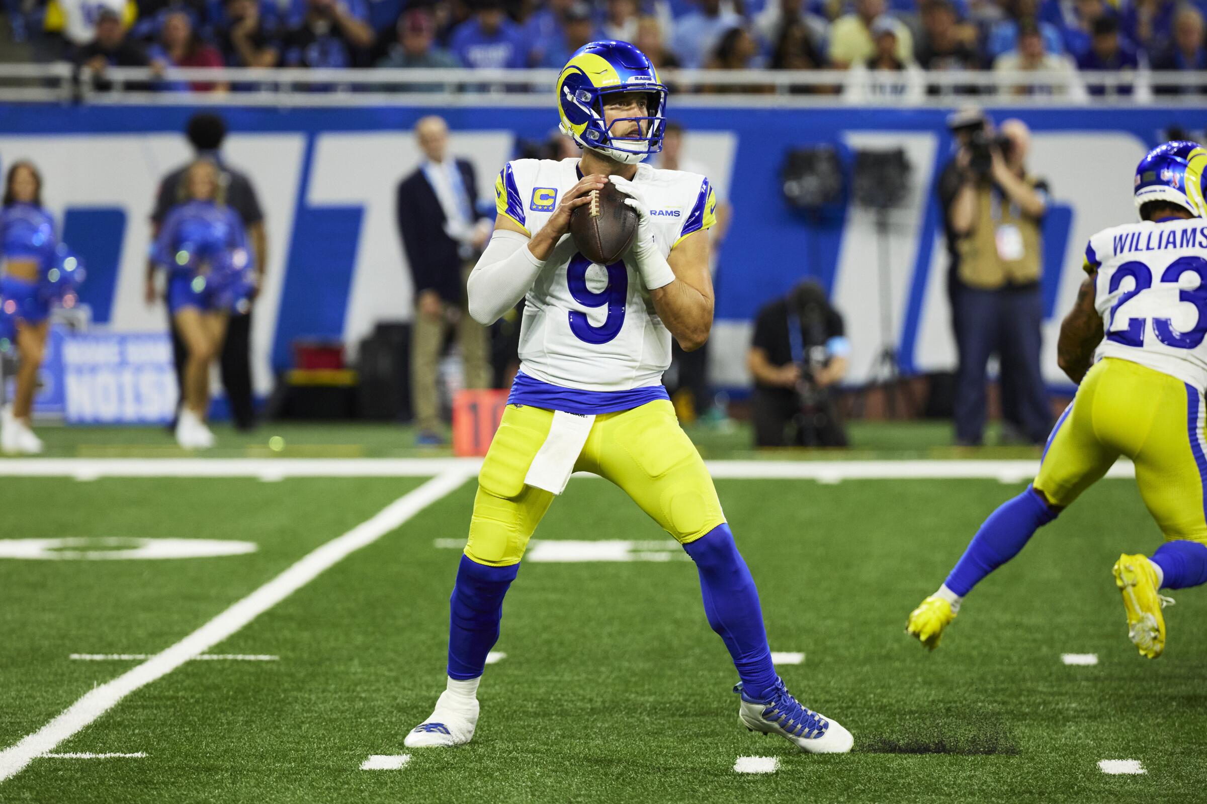 Rams quarterback Matthew Stafford looks to pass 