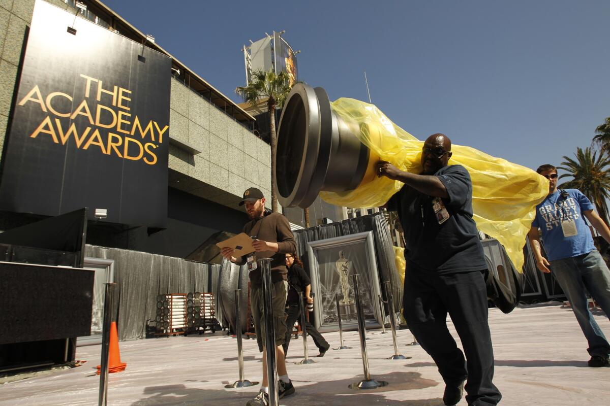 ABC will live stream the Academy Awards this year on a limited basis. Oscar statues are moved into place as preparations are made for the 2012 ceremony.