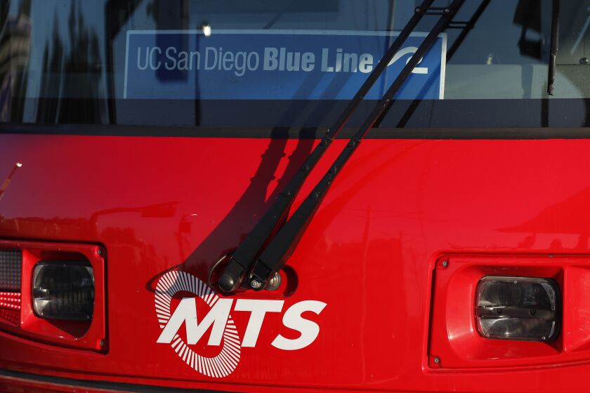 SAN DIEGO, CA - OCTOBER 14: A trolley on the MTS Mid-Coast Extension Blue Line is stopped at the UC San Diego central campus stop on Thursday, Oct. 14, 2021 in San Diego, CA. (K.C. Alfred / The San Diego Union-Tribune)