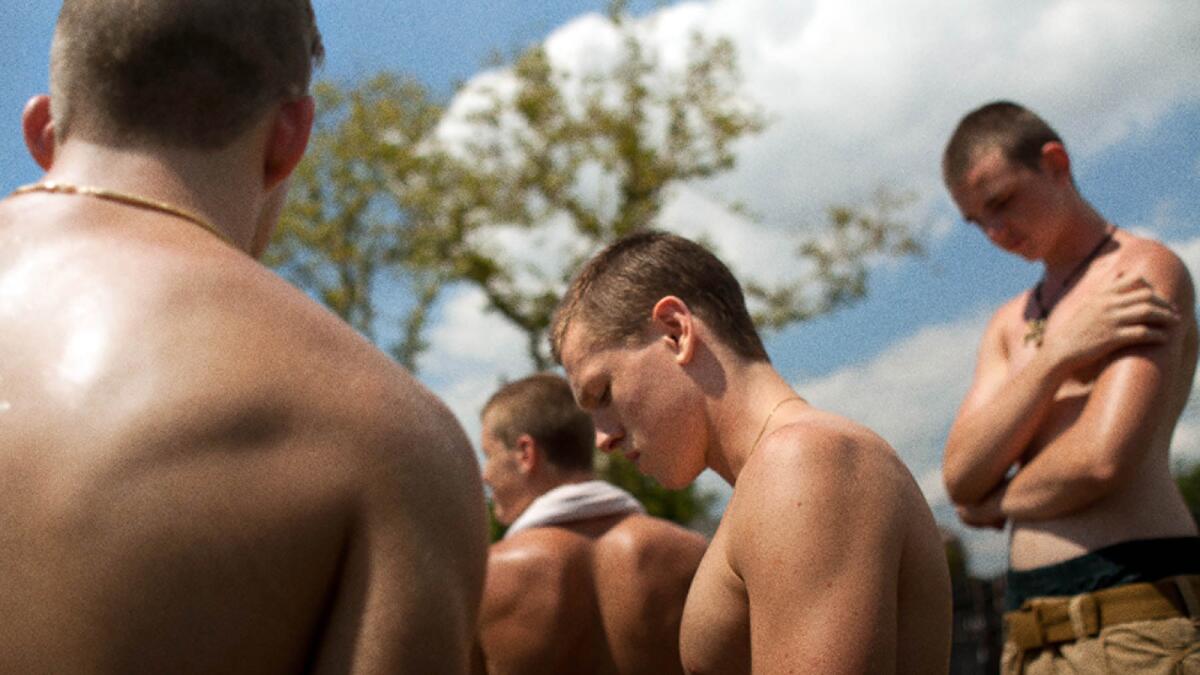 Harris Dickinson, center, in the film "Beach Rats" by Eliza Hittman.