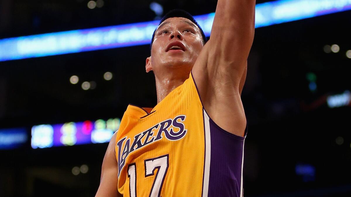 Lakers guard Jeremy Lin scores on a layup against the Golden State Warriors on Thursday.