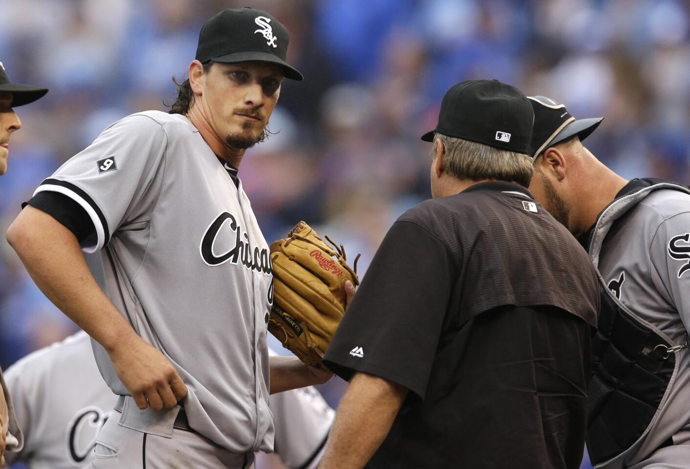 Jeff Samardzija talks with pitching coach Don Cooper after giving up a home run in the fifth inning.