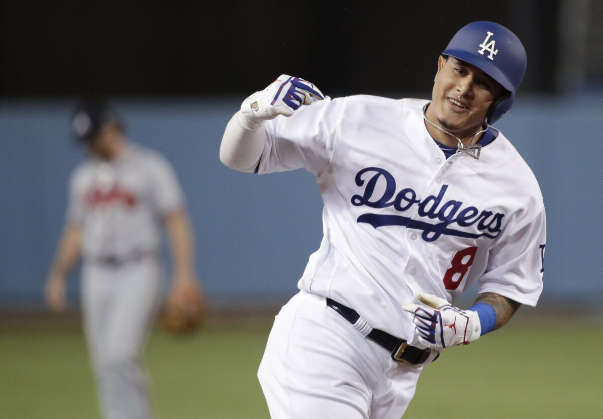 Dodgers' Manny Machado celebrates a two-run home run against the Atlanta Braves during the Game 2 of the 2018 NLDS.