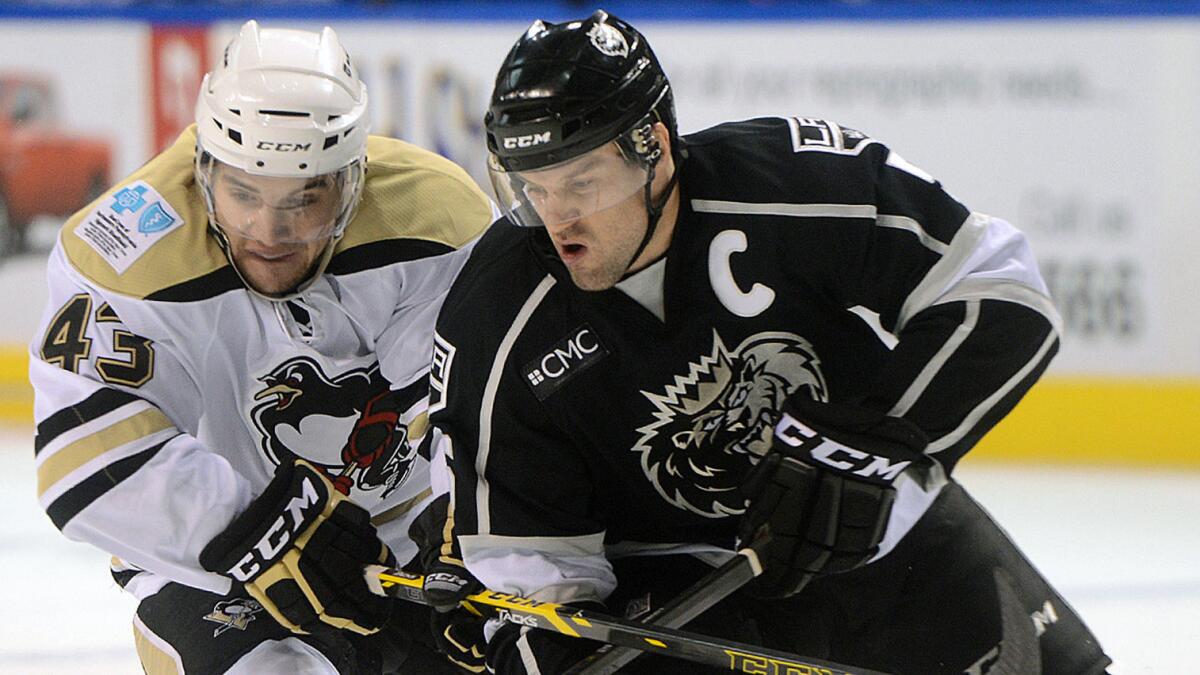 Wilkes-Barre/Scranton Penguins forward Conor Sheary, left, tries to steal the puck away from Manchester Monarchs defenseman Vincent LoVerde during an AHL game on Nov. 22.
