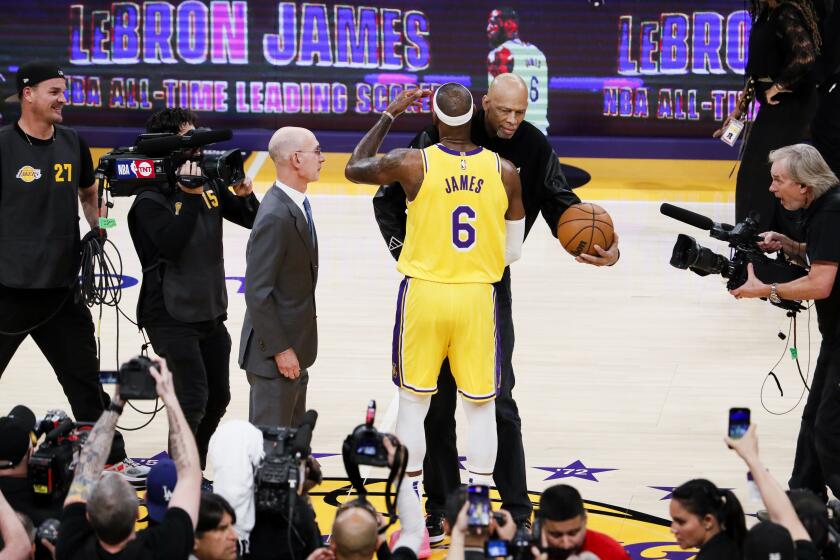 LOS ANGELES, CA - FEBRUARY 07: Los Angeles Lakers forward LeBron James (6) hugs Kareem Abdul-Jabbar after making a shot to become the all-time NBA scoring leader, passing Kareem at 38388 points during the third quarter against the Oklahoma City Thunder at Crypto.com Arena on Tuesday, Feb. 7, 2023 in Los Angeles, CA.(Robert Gauthier / Los Angeles Times)